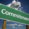 When will he commit? This is always the question you're really asking. How do you know how long to wait for commitment? And what if you've had enough and decide to move on right before he is ready to commit? Commitment road sign under a blue sky with clouds.