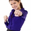 With that same resolve, with that same kind of confidence. You really do have that same kind of confidence, that same kind of right to stand up for yourself and let him know what you will and will not take. A woman is showing her confidence holding out her fist and smiling.