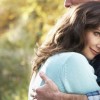 It's time to define for yourself exactly what commitment looks like to you. A beautiful woman is embracing her man in a committed relationship after he has professed his commitment to her in an autumn woodland setting.