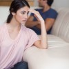 We all want to know the secret to just letting go and not going back. But the reality is that there is no secret. A beautiful woman sits on the floor leaning on the couch with her boyfriend several feet away, in the middle of letting go.